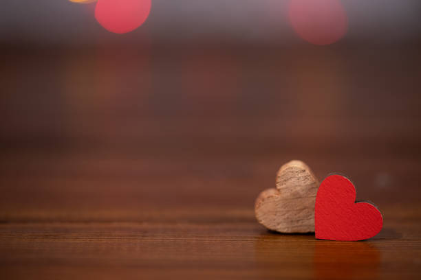 istock Two hearts on a wooden background with copy space. Valentine's day concept 1298690881