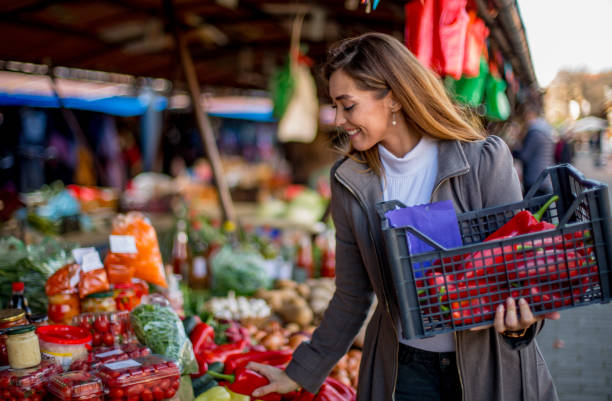 istock Young girl on market. 1298691570