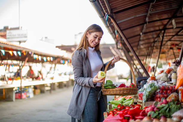 istock Young woman holding yellow bell pepper. 1298691893