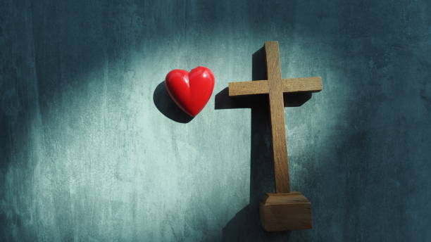 istock Red heart with wood crucifix 1298692209