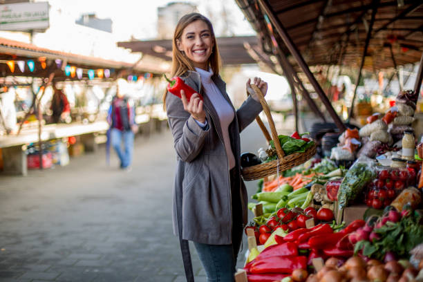 istock Market. Buying vegetables. 1298693318
