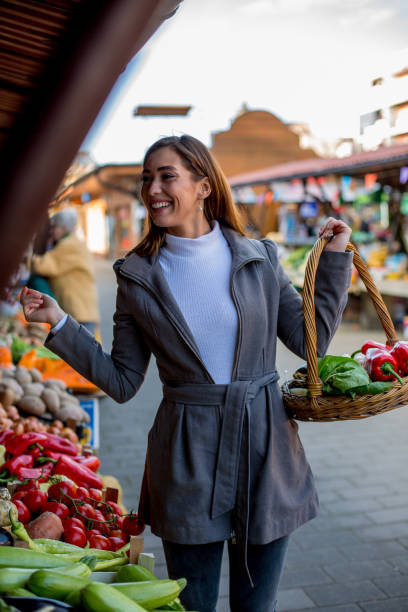 istock Lady is talking with her supplier and asking for cherry tomatoes. 1298693754