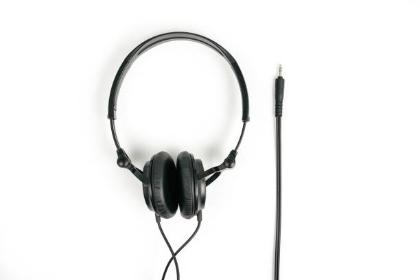 istock Black headphones on white background 1298695873