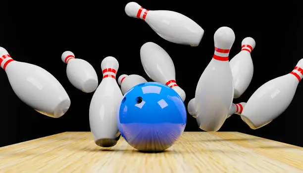 Photo of 3d render of a bowling strike with skittles and a ball.Digital image illustration.