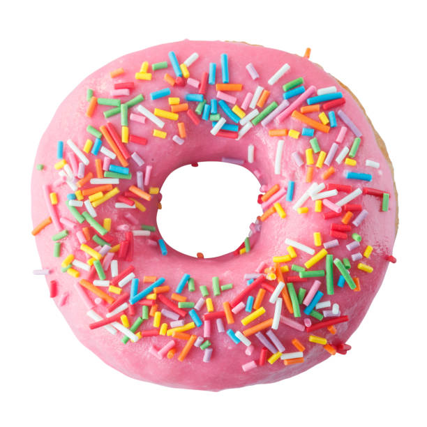 istock Donut in pink glaze with colored sprinkles. 1298698923