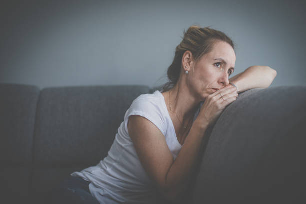 istock SDepressed mid-aged woman at home feeling sad, lonely, anxious 1298702299