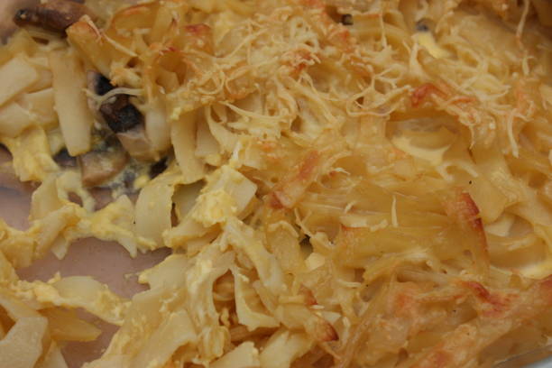 istock Tagliatelle pasta gratin with mushrooms and eggs  Vegetarian dish 1298704198