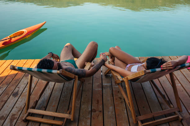 istock Couple holding hands on the deck 1298704646