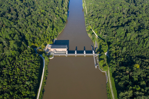 Water flowing from dam aerial landscape view