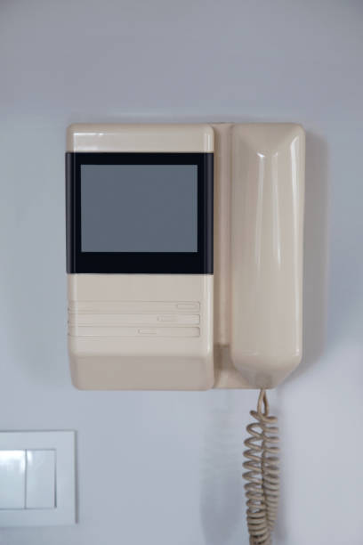 istock Internal intercom with a handset for conversation and a video surveillance screen in a white body 1298721674