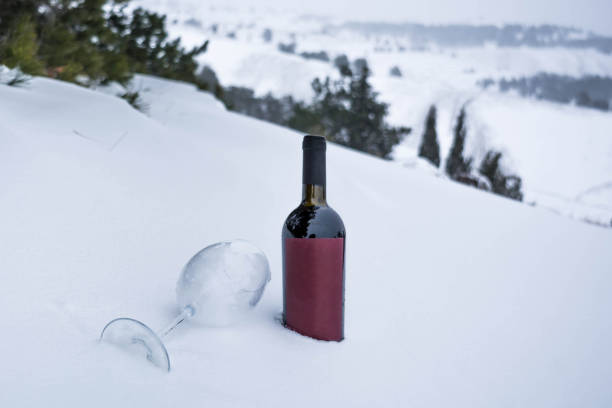 istock Wine bottle in the snow 1298723956