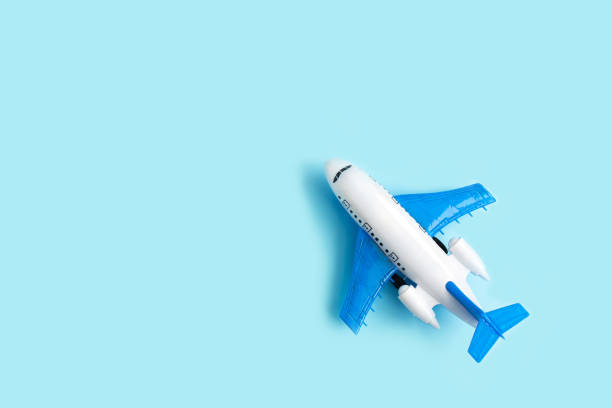 istock Toy airplane on a blue pastel background. Model plane. 1298725136