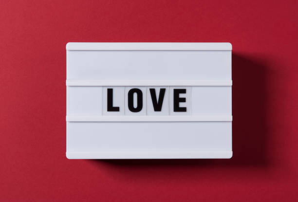 istock Love Text And Red Heart Shape on White Light Box 1298729789