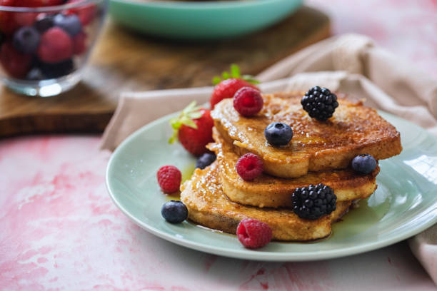 istock French Toast with Berries and Maple Syrup 1298734088