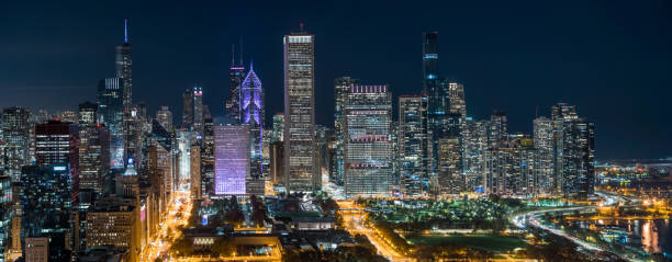 istock Panorama of Chicago Skyline at Night 1298747687
