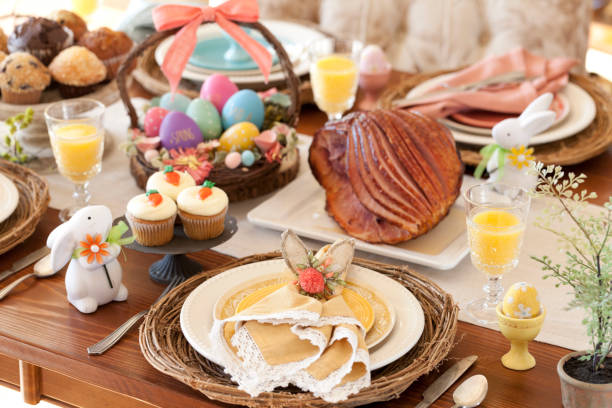 Easter Dining Table Easter Dining Table with Yellow Place Setting carrot cake day stock pictures, royalty-free photos & images