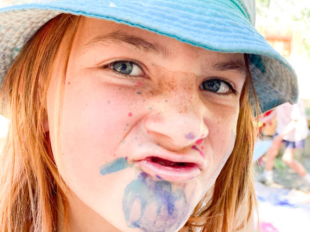 istock Children paint, create, and work on art with their teacher outside. 1298757515