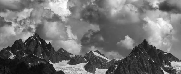 istock Panoramic view on high mountains with glacier and cloudy sky at summer day 1298757813