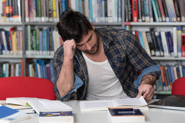 istock Angry Man With Too Much Paperwork to Do 1298759590