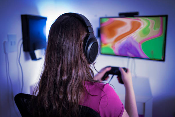 istock Young woman gamer playing video game 1298770900