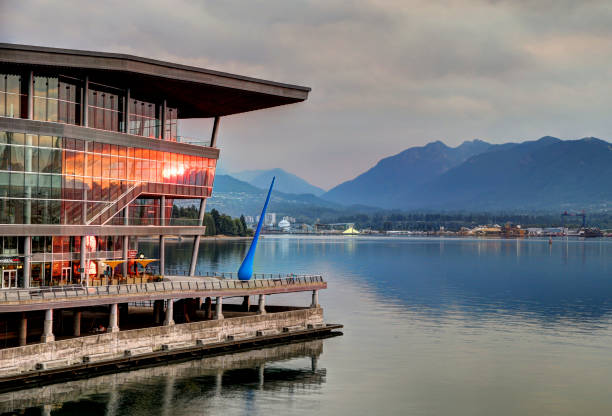 views of canada place on the waterfront of vancouver at sunrise - vancouver harbor imagens e fotografias de stock