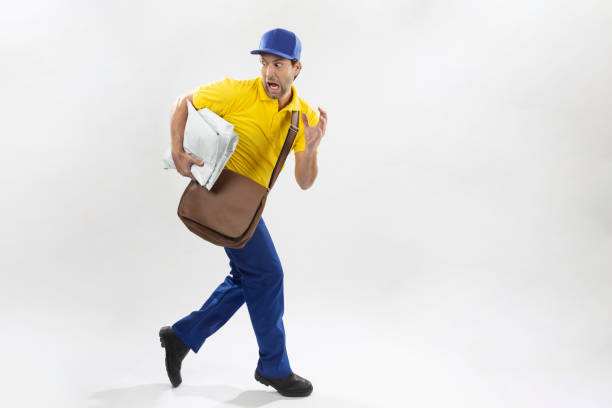 Brazilian mailman running with a package on a white background. copy space.