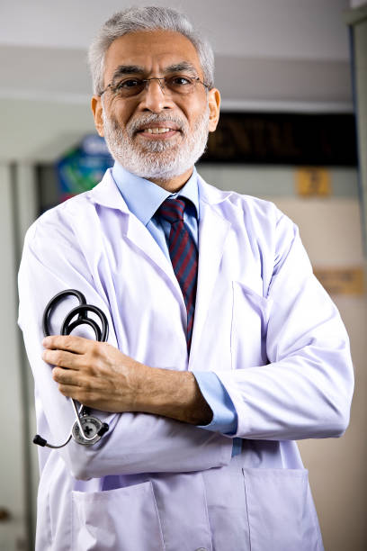 istock Senior male doctor looking at camera 1298791672