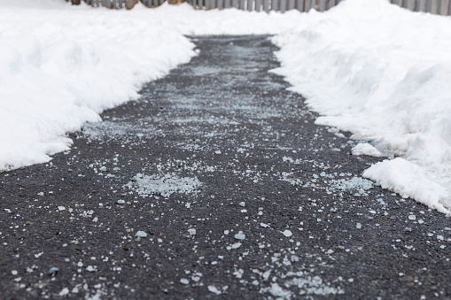 Carretera con sal y nieve en los laterales photo