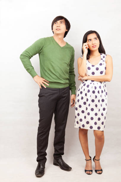 Couple Standing together Need Solution Couple Posing Standing Need Solution isolated on white malay couple full body stock pictures, royalty-free photos & images