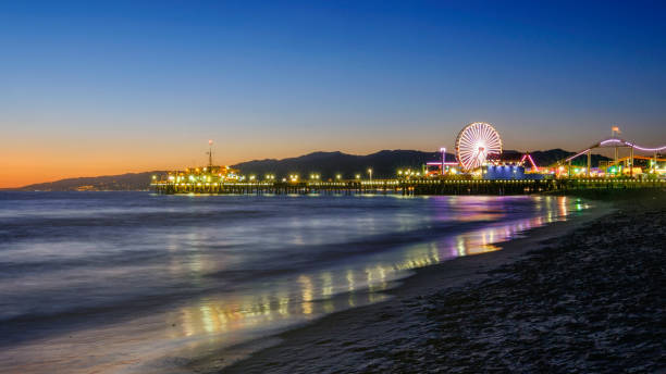 Santa Monica Pier California Sunset view of Santa Monica Pier on the Pacific Ocean California santa monica stock pictures, royalty-free photos & images