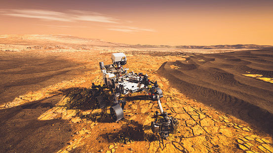 Unmanned rover vehicle on Mars exploration mission runs through planet ground . 3D illustration . Elements of this image furnished by NASA