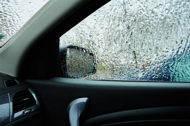 istock Inside view from car covered in freezing rain. Ice on car windshield. Extreme winter weather for a driving 1298809483