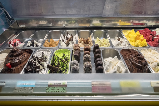 Ice cream display case featuring a variety of ice cream, sorbets, and ice cream bars for sale in Tulum, Mexico.