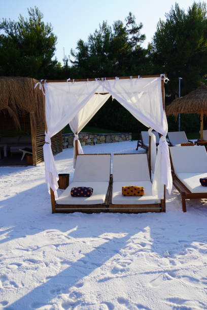 istock Beautiful beach landscape at Lux hotel, Sunbed on white sand 1298814543