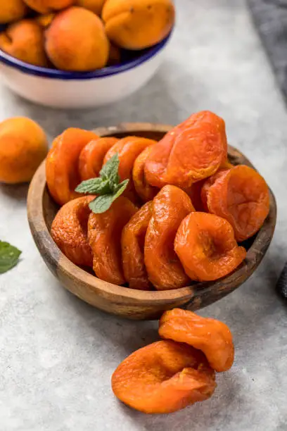 Photo of Dried apricots are popular in cooking, sweet dried fruit, healthy food, compote making.