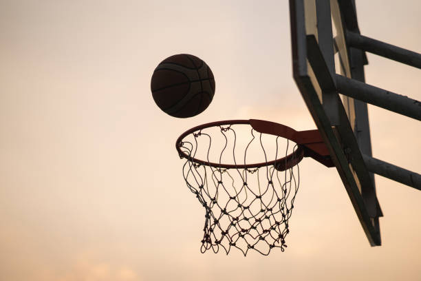 istock Scoring the winning points at a basketball game 1298826141