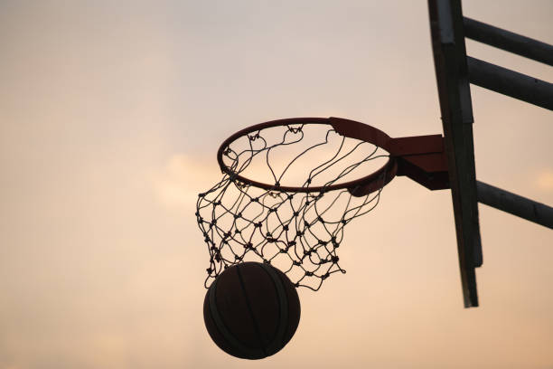 istock Scoring the winning points at a basketball game 1298826251