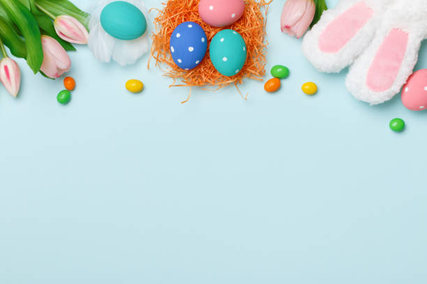 istock Easter composition on a blue background. Top view banner with copy space flat lay greeting card. 1298829624