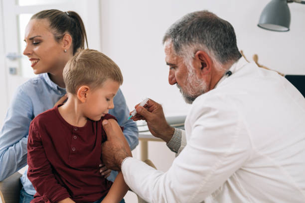 istock boy with his mother visit pediatrician 1298830088