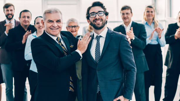 istock project Manager congratulating the best employee on the victory 1298830891