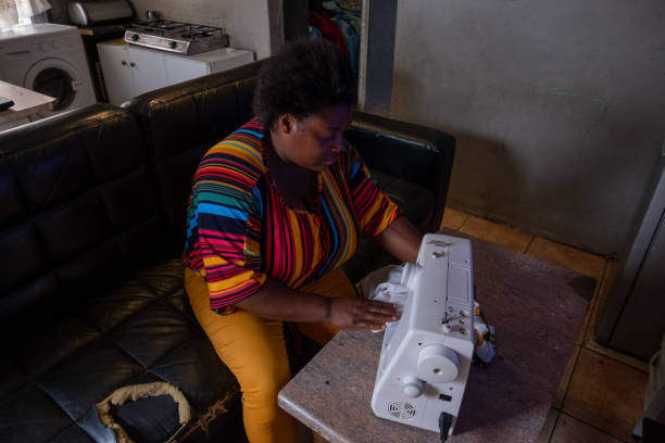 istock African woman sewing garments 1298834411