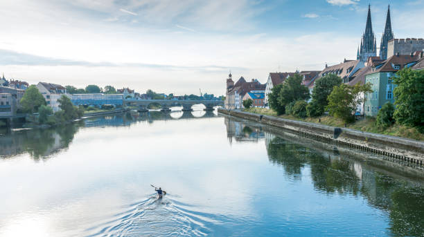 istock Bridge Over River With City In Background 1298836536