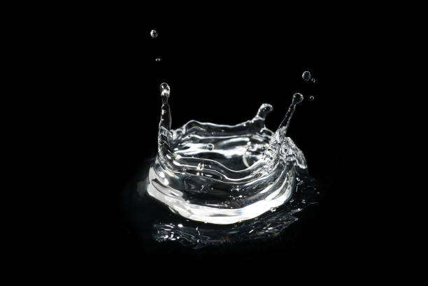 istock water splash isolated on black. fresh clean transparent drinking water splash. 1298841513