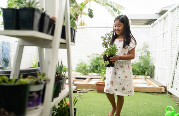 istock Small kid enjoying to work in garden. 1298843437