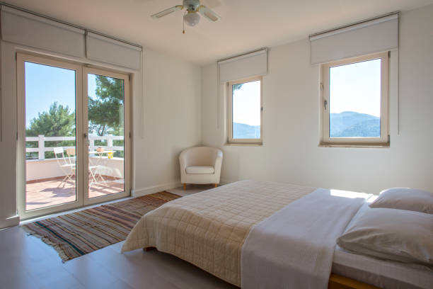 istock Simple,White Bedroom Interior with Blanket and Pillows on  Bed 1298847401