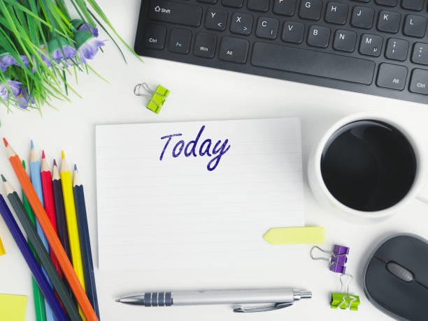 istock Today's agenda. flat lay office workspace desk with coffee,blank notebook with today plan, electronic devices and pens. organizer mockup concept for blog or header with space for text or copy space 1298847531