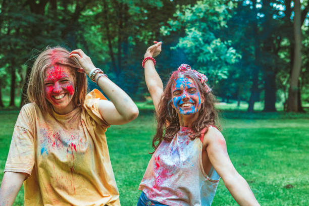 istock two women girlfriends having fun at holi fest 1298852500