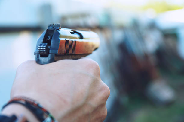 istock Gun in the hands of man 1298853814