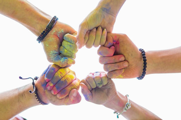 istock friends hands close up in holi paint 1298853819