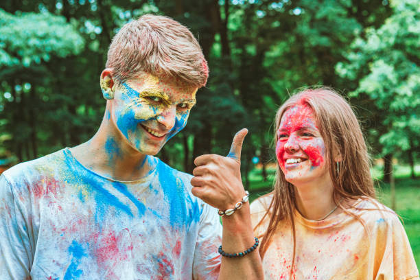 istock young pretty couple having fun at holi fest 1298856027